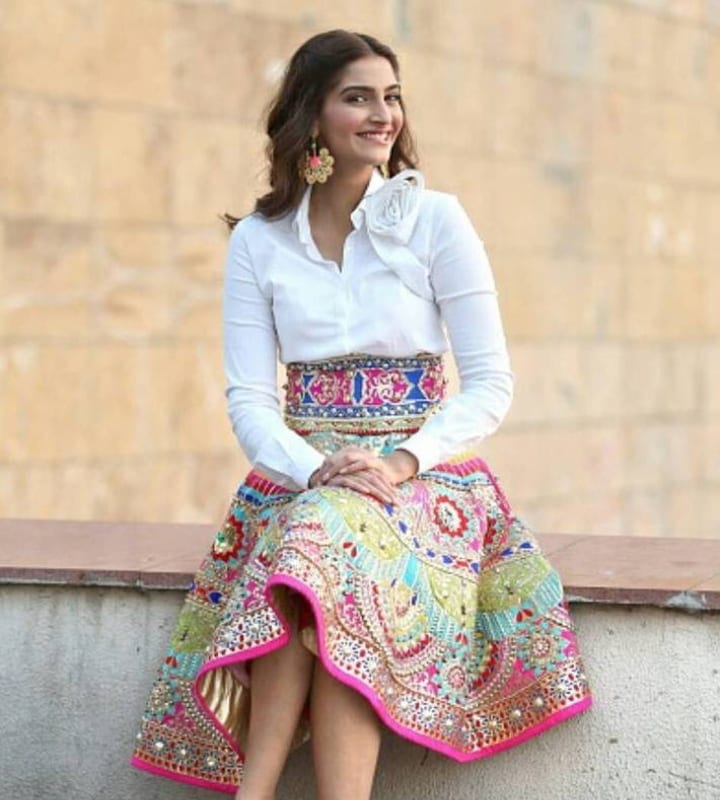 Sonam Kapoor is known for her fashion and style. For the promotions of Khoobsurat, she immersed her character, Milli, into her looks. Milli is known for loud, quirky, outgoing nature. Sonam wore loud patterns and bright colours to promote her movie. (Photo: X/@bolly_report)