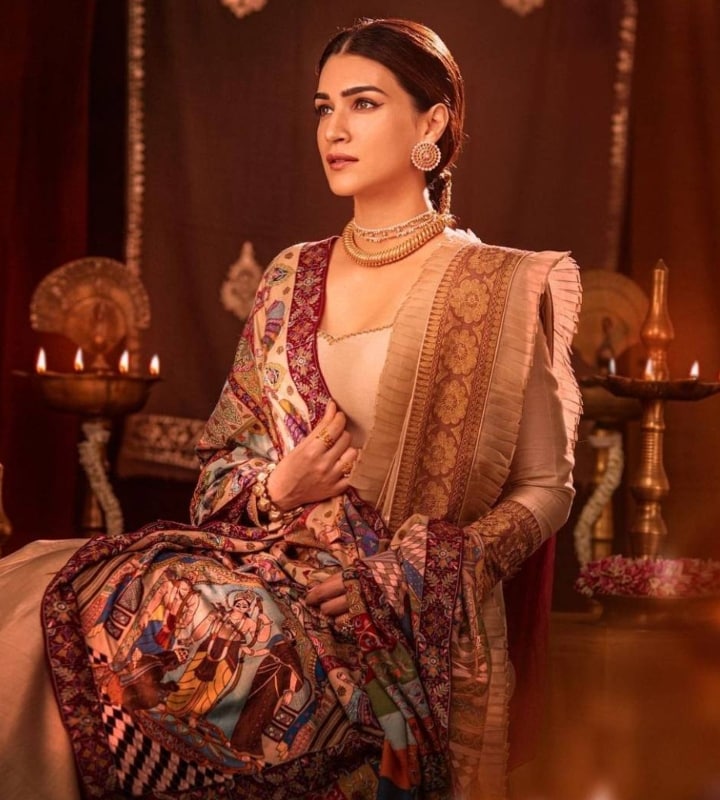 Kriti Sanon took to method dressing for her movie Adipurush. The movie is based on the epic Ramayana, in which she plays the role of Janaki. While promoting the movie, she was seen wearing heavy traditional outfits. In this look, she wore a shawl which had intricate embroidery of the scenes of Ramayana. (Photo: Instagram/@kritisanon)