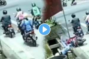 girl came with a scooty and fell straight into the drain