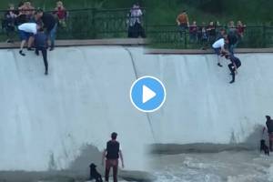 A group of people Make A human chain to rescue a dog stuck in a water reservoir watch this heartwarming Viral video