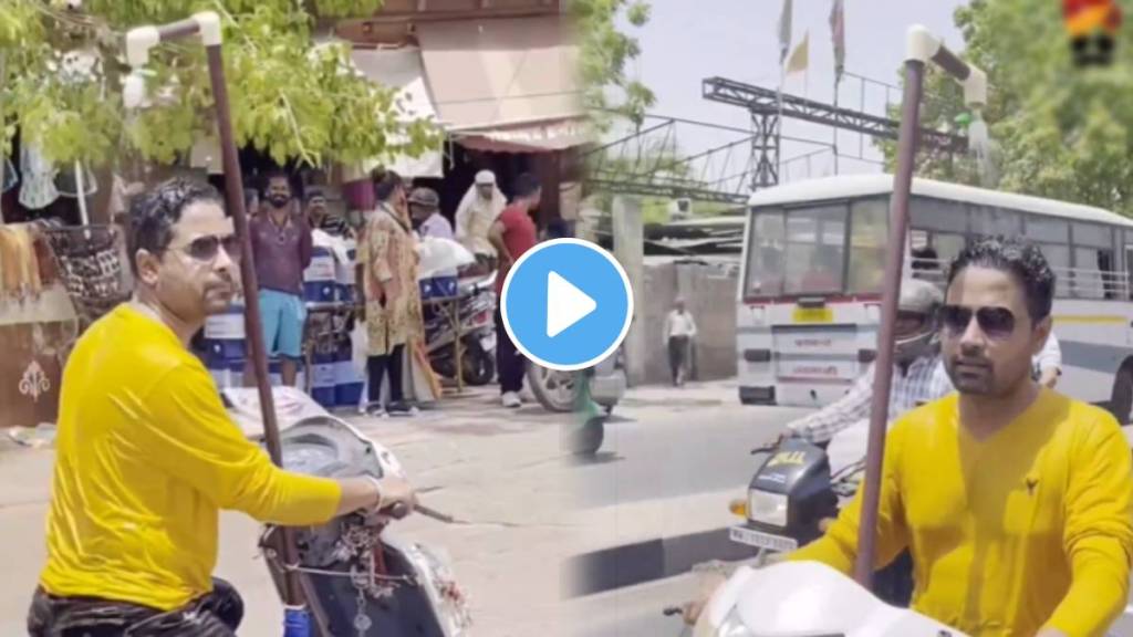 man installing a makeshift shower on his scooter jugaad For heatwave viral on social media must watch this video