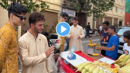 foreigner Tries Indian Street Food corn from a vendor selling it on a cart And Shares It With Underprivileged Girls watch ones