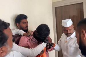 Dr Ramesh Tarakh face blackened by Maratha protesters