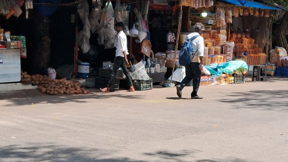 Shopkeepers at the Mumbai Agricultural Produce Grain Market display their wares on the road