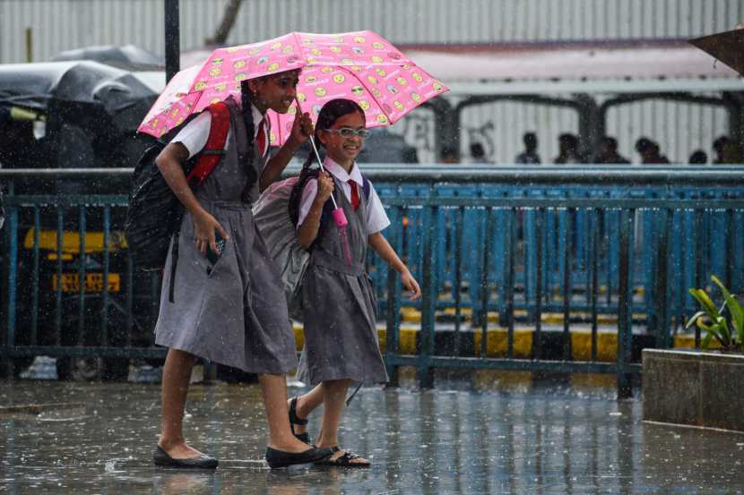 Pedestrians experience sudden rain at Bandra,