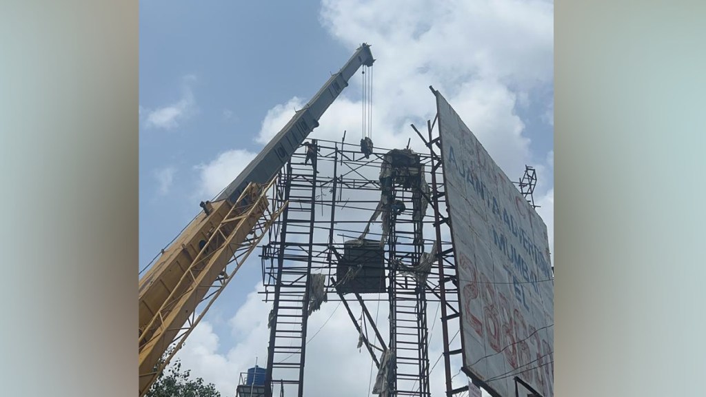 A dangerous advertisement board near Panvel Bus Agar was pulled down