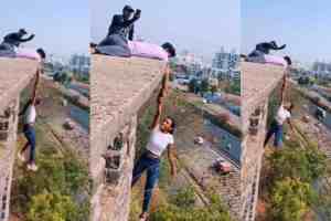 Pune Influencer viral Video, Pune Police Register Case Against Youths for Dangerous Reels Stunt, Dangerous Reels Stunt Near Katraj New Tunnel, Pune Influencer Video, Young Girl Floating in Air Hanging From roof Of Building, Boy holding hand, People Got Angry Said Why Threaten Life, trending news, trending today, trending topics, trending videos, trending news today, latest trends, top trends, trending now,