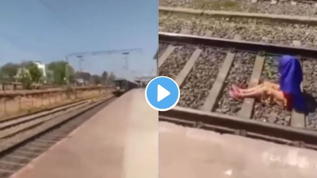 Girl talking on the phone on railway track