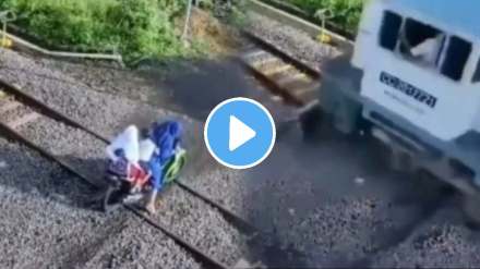 one woman with two child crossing railway track with scooter then train arrived accident