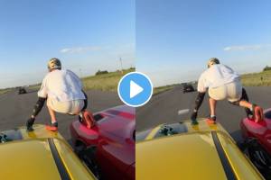 man stands on top of two speeding cars and when both cars reach a third car And Jump on It ahead watch viral video ones