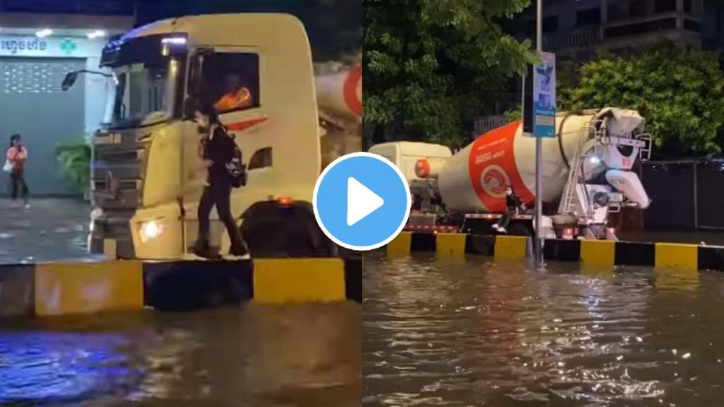 truck driver helps young girl cross waterlogged street during heavy rainfall