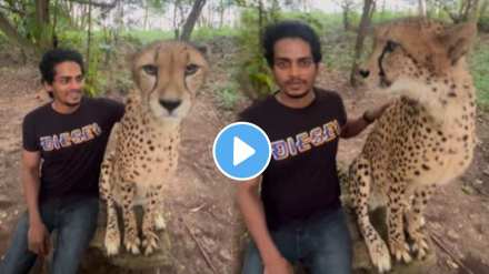 The young man went to the forest and took a picture with cheetah