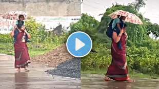 mother carrying kid on shoulder to protect from heavy rain netizens gets emotinal heartwarming video