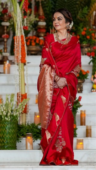 ambani family mass wedding nita ambani red saree viral