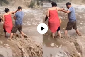 a woman was lucky was rescued by local people at waterfall shocking video goes viral