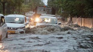 note down tips while driving car on waterlogged Road in rainy season