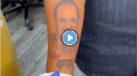 ncp leader ajit pawars fan draws a tattoo of ajit pawar on a hand video goes viral