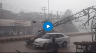 Watch Electric pole falls on moving car amid heavy rain in Rajasthan passengers escape unhurt