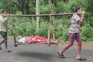 A cot handle to take the injured father to the hospital after falling while doing farm work  in gadchiroli