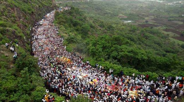 File photo of lakhs of Warkaris crossing the Dive ghat near Saswad along with Sant Dnyaneshwer Palkhi during the month-long annual Pandharpur pilgrimage. (Express photo by Arul Horizon)