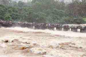 Pune, Khadakwasla Dam, Mutha River, flood alert, 35000 cusecs, heavy rainfall, Water Resources Department, riverbanks, Baba Bhide bridge, Municipal Corporation, safety precautions, pune news