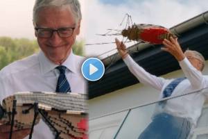 Bill Gates seen dropping a mosquito made of Lego from a tall building