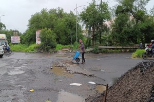 Repair of potholes, Uran-Panvel road,