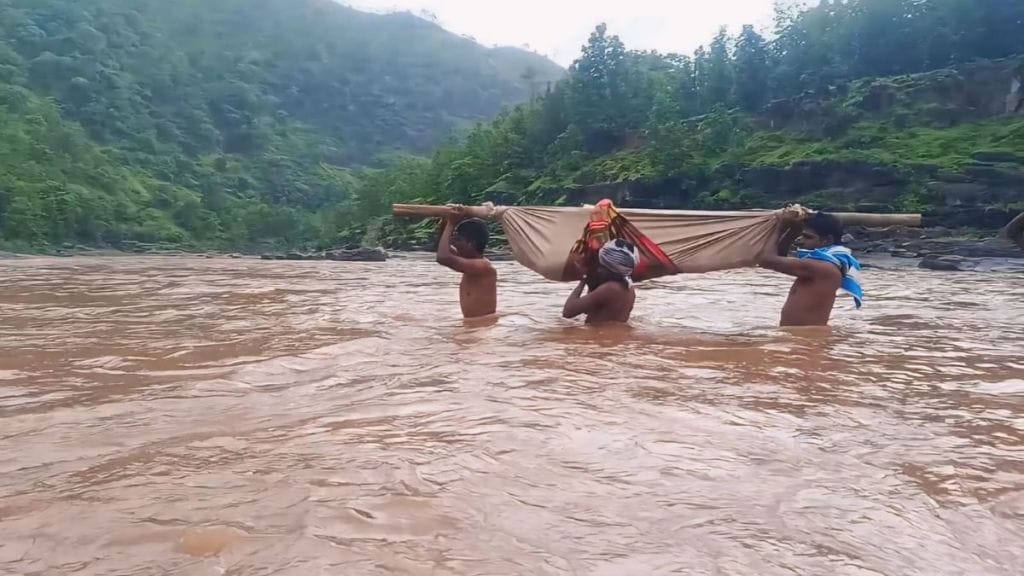 Efforts to carry pregnant woman through the flood water in bag inconvenience to tribals in Nandurbar district