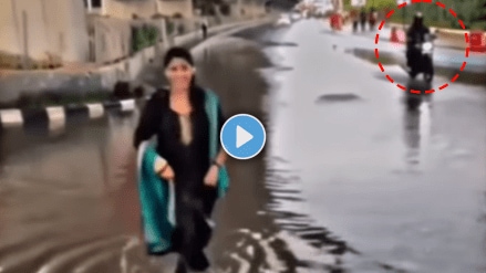 Viral Video of woman dancing on road bike rider throw rainwater on her made her all wet