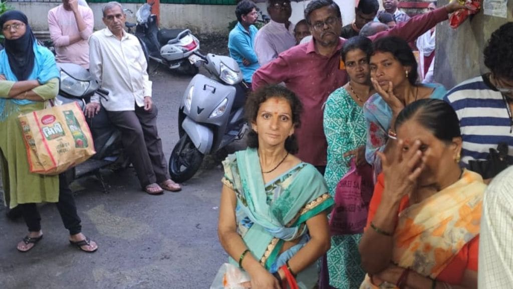 Women queue at ration shops for food grains as servers are down