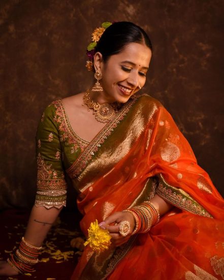 shreya-budge-instagram-photo-orange-saree