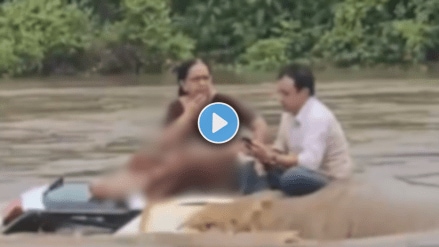 Couple spends 2 hours on top of submerged car amid Gujarat rain (