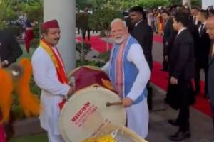 Prime Minister Narendra Modi tries his hands on a dhol.