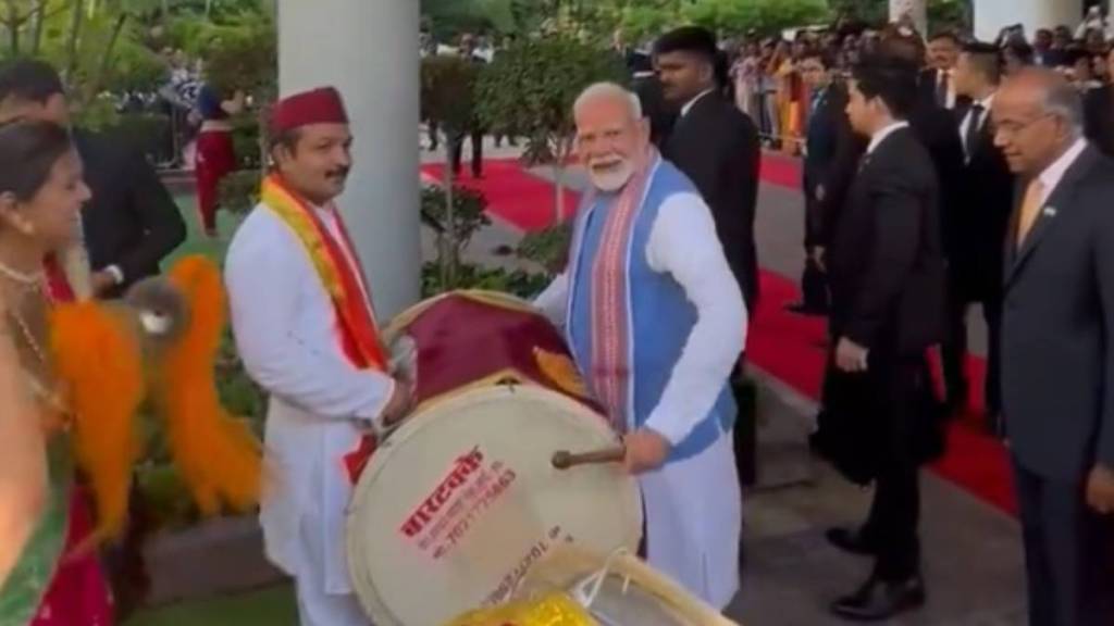 Prime Minister Narendra Modi tries his hands on a dhol.