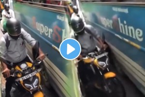 Shocking video bike rider got stuck between the-two buses video