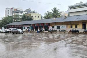 Passengers struggled in heavy rain bus stand closed for a memorial ceremony