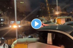 Train is seen stuck in the middle of traffic at the railway gate in bengaluru video