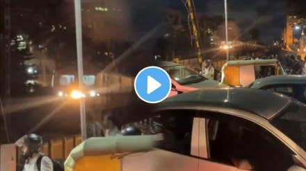 Train is seen stuck in the middle of traffic at the railway gate in bengaluru video