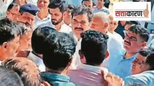 BJP leaders Kuldeep and Bhavya Bishnoi with a group of villagers in their constituency Adampur on Monday. (Express Photo