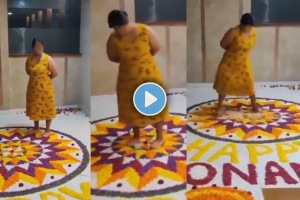 The woman can be heard speaking in Malayalam as she stands on the Onam Pookalam. (