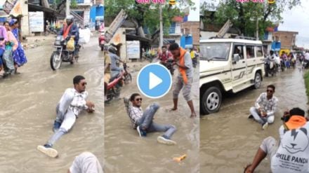 A young guy did a photo shoot in the water flooding on the road