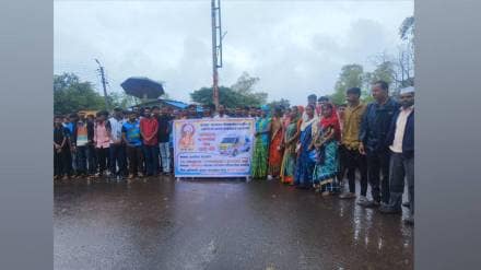 plaque noted 108 lost ambulances at Borgaon Health Centre garlanded during rainy protest