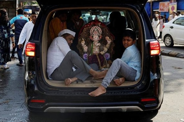 Ganesh Chaturthi celebrations 2024, Ganpati Bappa Morya chants, Ganesh idols installation, Ganesh Utsav in India, Famous Ganpati pandals in Mumbai