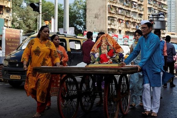 Ganesh Chaturthi celebrations 2024, Ganpati Bappa Morya chants, Ganesh idols installation, Ganesh Utsav in India, Famous Ganpati pandals in Mumbai