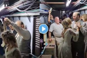 Footage of the couple in their wedding attire captured them slow dancing in the cramped, dusty shelter while their guests watched on