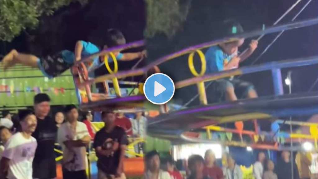 A small boy performing a deadly stunt in the Ferris Wheel