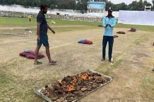 Ranji Trophy 2024 Drying Pitch By Burning Cow Dung Cakes Desi Jugaad In Match Bihar vs Karnataka