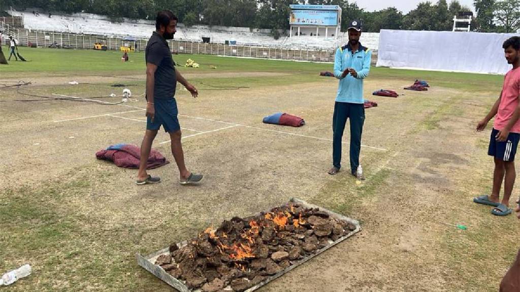 Ranji Trophy 2024 Drying Pitch By Burning Cow Dung Cakes Desi Jugaad In Match Bihar vs Karnataka