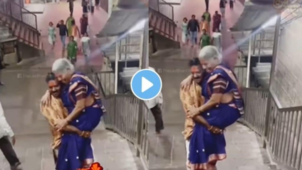 a son lifted the mother While climbing the steps of the temple emotional video