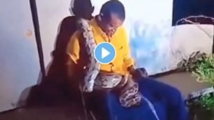 Video : A big python crawled over a drunk man